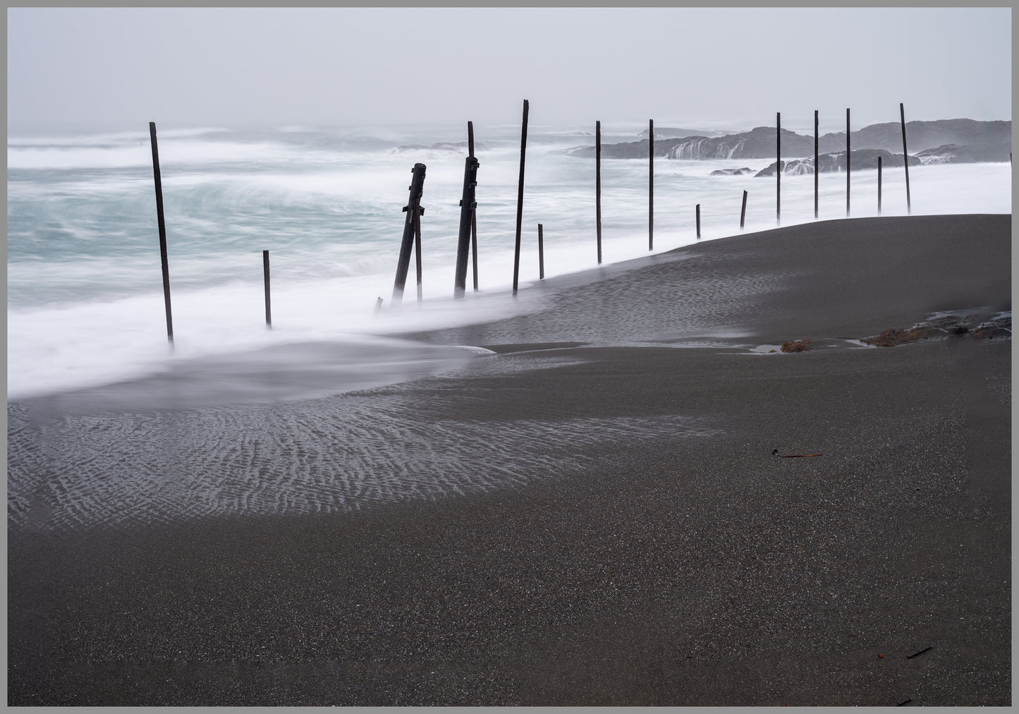 Black sand and wild waves thrill me with questions.