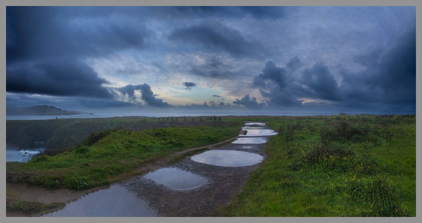 Cloud strewn puddles turn abstract with our passing.