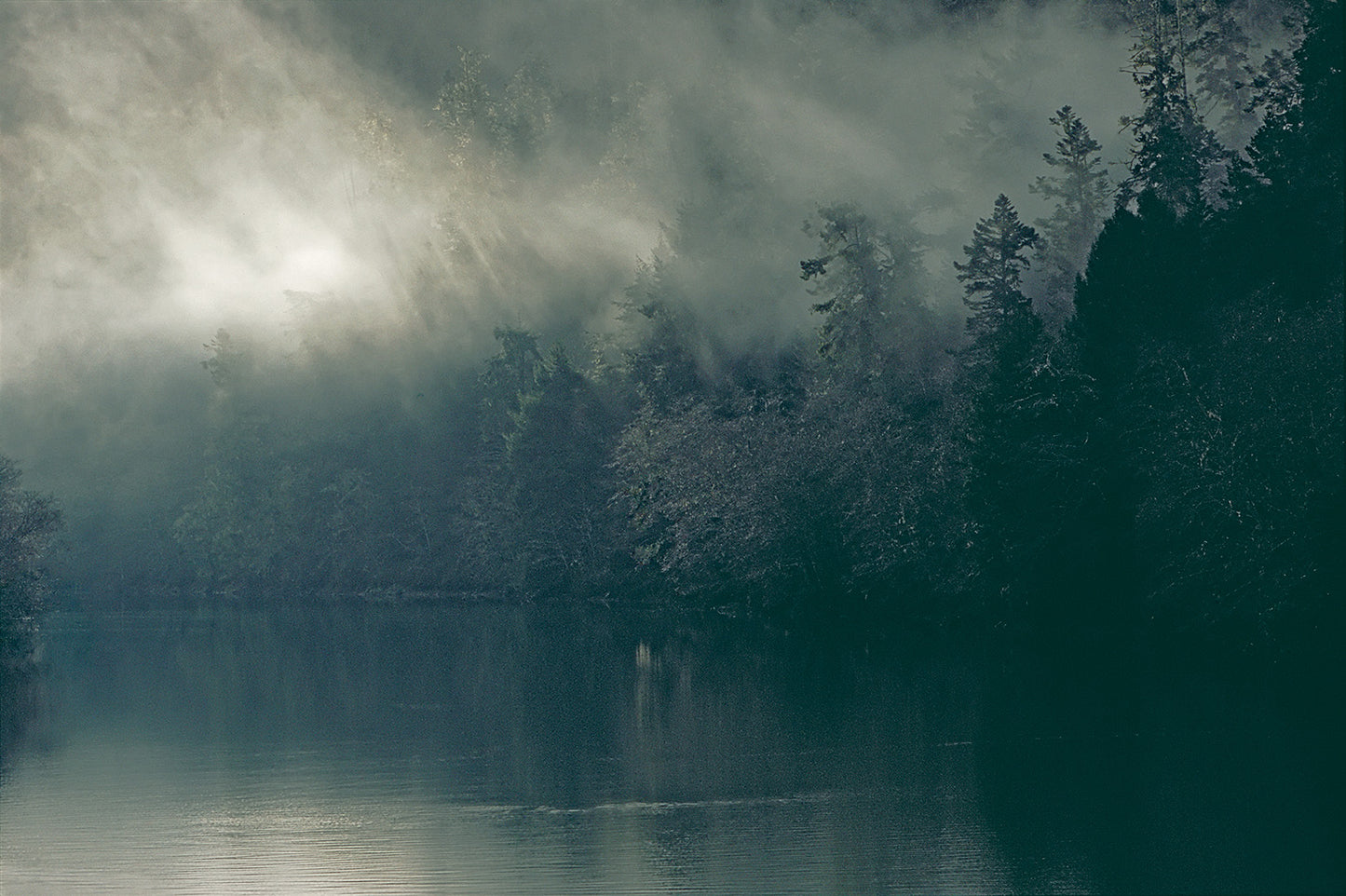 Low Clouds and Light Rays Over River